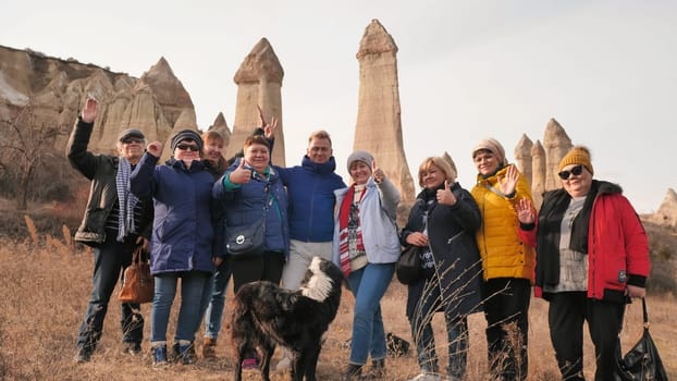 Russian tourists posing in the Valley of Love in Goreme Cappadocia Turkey during the freezing winter months