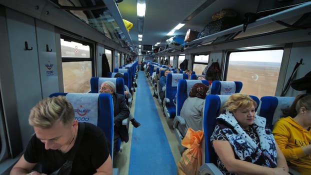 Wagon of a passenger train with passengers in Turkey