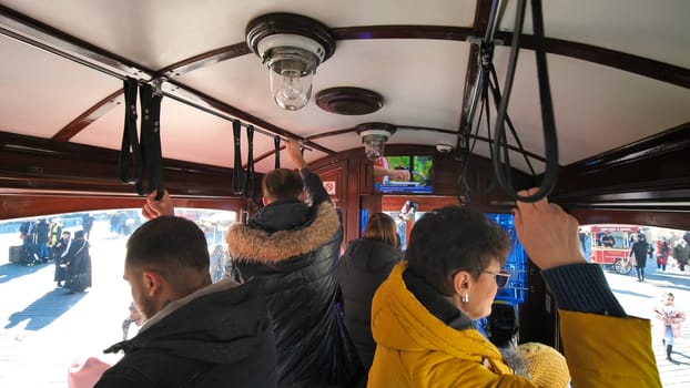 Wagon with passengers in an old vintage tram in Istanbul.