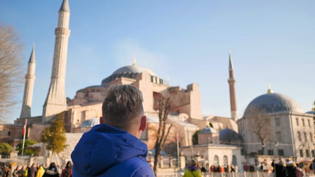 Tourist on the background of Hagia Sophia in Istanbul
