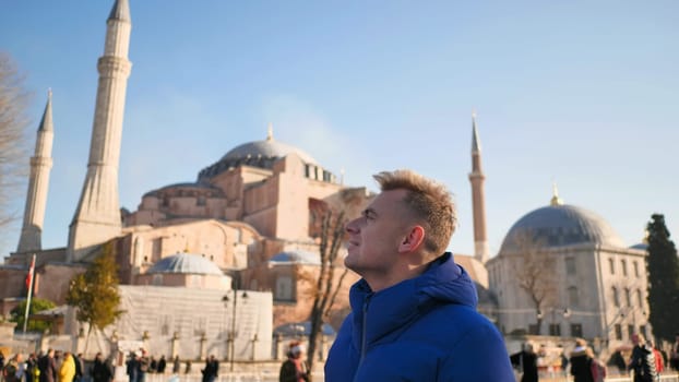 Tourist on the background of Hagia Sophia in Istanbul