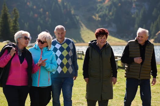 A family shares delightful moments with their friends amid the stunning landscapes of mountains, lakes, and winding paths, promoting a healthy lifestyle and the joy of familial bonds in the embrace of nature's beauty.