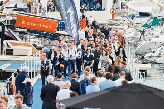 Monaco, Monte Carlo, 29 September 2022 - The famous motorboat exhibition, mega yacht show, clients and yacht brokers discuss the novelties of the boating industry, look at the mega yachts presented. High quality photo