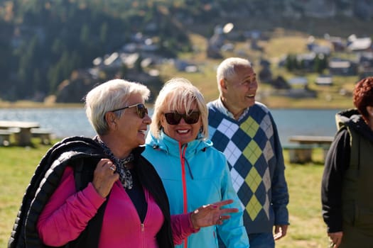 A family shares delightful moments with their friends amid the stunning landscapes of mountains, lakes, and winding paths, promoting a healthy lifestyle and the joy of familial bonds in the embrace of nature's beauty.