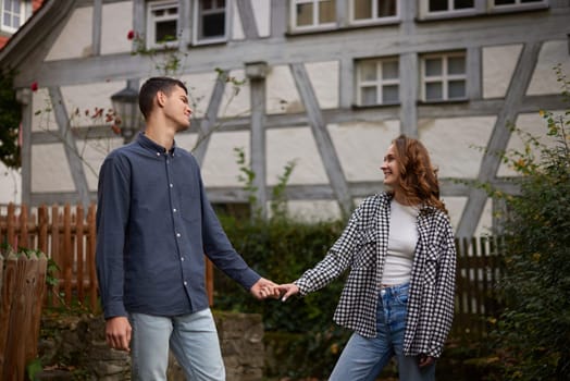 Young Cute Female Hugs Boyfriend. In Autumn Outdoor. Lovers Walking in Park. Attractive Funny Couple. Lovestory in Forest. Man and Woman. Cute Lovers in the Park. Family Concept. Happy Couple.