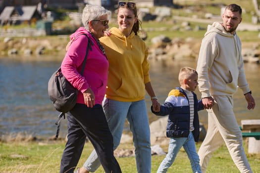 A family shares delightful moments with their friends amid the stunning landscapes of mountains, lakes, and winding paths, promoting a healthy lifestyle and the joy of familial bonds in the embrace of nature's beauty.