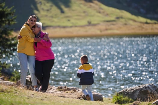 A family shares delightful moments with their friends amid the stunning landscapes of mountains, lakes, and winding paths, promoting a healthy lifestyle and the joy of familial bonds in the embrace of nature's beauty.