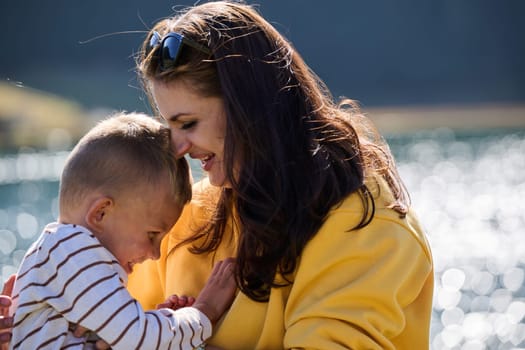 A mother and son create cherished memories as they playfully engage in outdoor activities, their laughter echoing the joy of shared moments and the bond between parent and child.