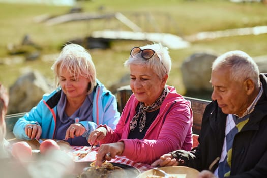 A family on a mountain vacation indulges in the pleasures of a healthy life, savoring traditional pie while surrounded by the breathtaking beauty of nature, fostering family bonds and embracing the vitality of their mountain retreat.