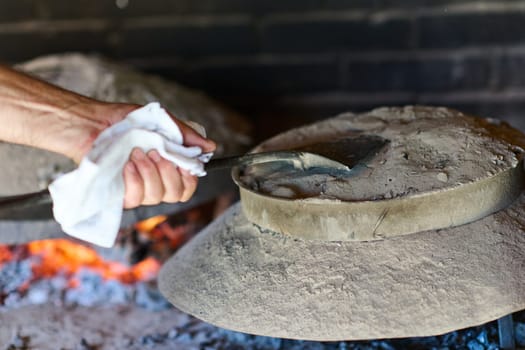 Capturing the essence of Bosnian culinary tradition, step-by-step preparation of a traditional Bosnian pie, showcasing the meticulous craftsmanship and authentic flavors involved in the culinary journey.