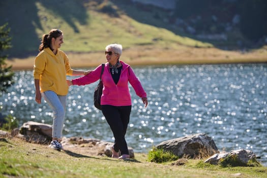 A family shares delightful moments with their friends amid the stunning landscapes of mountains, lakes, and winding paths, promoting a healthy lifestyle and the joy of familial bonds in the embrace of nature's beauty.