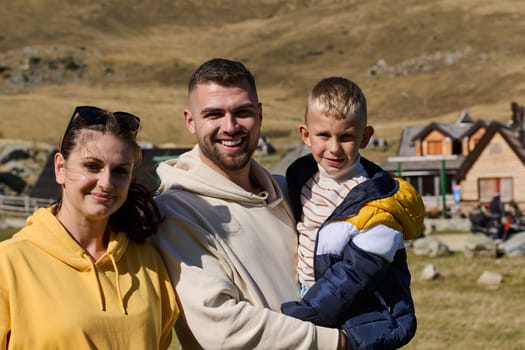 A modern family, along with their son, revels in the joy of a muddy day in nature, running and playing together, encapsulating the beauty of a healthy and active lifestyle.