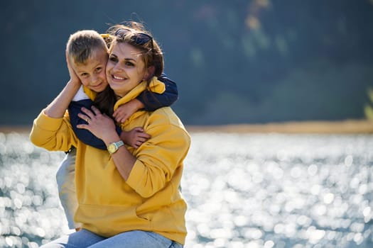 A mother and son create cherished memories as they playfully engage in outdoor activities, their laughter echoing the joy of shared moments and the bond between parent and child.