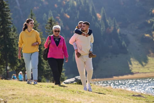 A family shares delightful moments with their friends amid the stunning landscapes of mountains, lakes, and winding paths, promoting a healthy lifestyle and the joy of familial bonds in the embrace of nature's beauty.