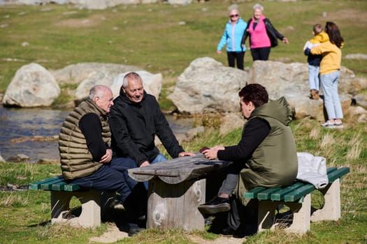 A family shares delightful moments with their friends amid the stunning landscapes of mountains, lakes, and winding paths, promoting a healthy lifestyle and the joy of familial bonds in the embrace of nature's beauty.