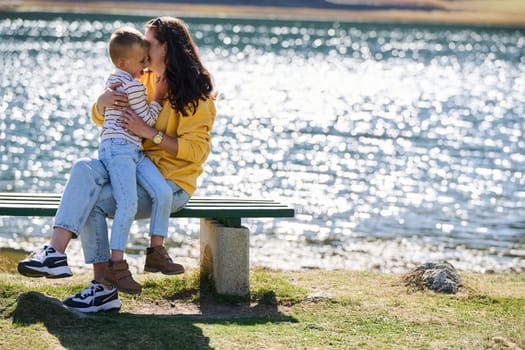 A mother and son create cherished memories as they playfully engage in outdoor activities, their laughter echoing the joy of shared moments and the bond between parent and child.