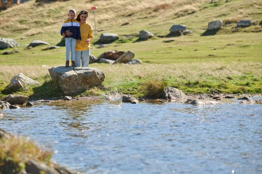 A mother and son create cherished memories as they playfully engage in outdoor activities, their laughter echoing the joy of shared moments and the bond between parent and child.