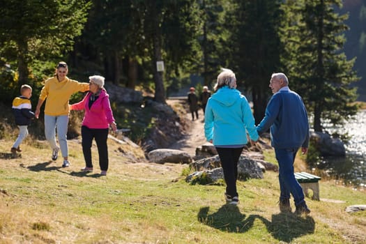 A family shares delightful moments with their friends amid the stunning landscapes of mountains, lakes, and winding paths, promoting a healthy lifestyle and the joy of familial bonds in the embrace of nature's beauty.