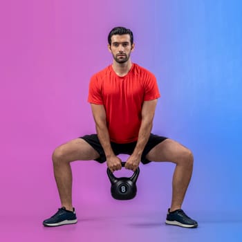 Full body length gaiety shot athletic and sporty young man with fitness in squat exercise posture on isolated background. Healthy active and body care lifestyle.