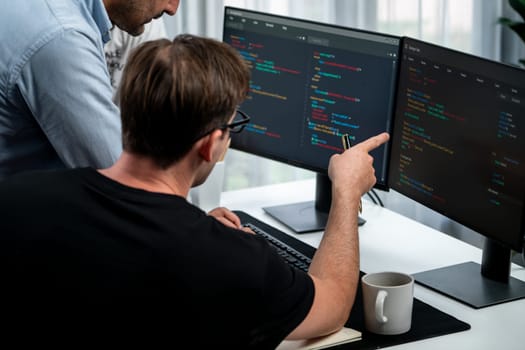 IT developers discussing online software development information on pc screen, creating program coding for latest version application on website. Concept of brainstorming firmware updated. Sellable.