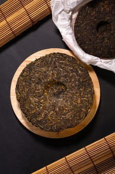 Chinese Puerh tea in the package. the Chinese dry the tea. the view from the top. Shen PUerh, Shu puer.