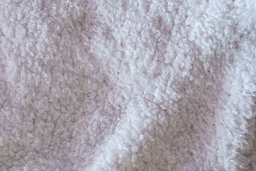 Whisper of Comfort, A Close-Up Capture of a Soft, Textured Fabric in Subtle Light