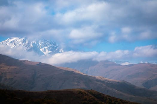 A majestic landscape with a winter snow-capped mountain, delighting with its beauty and silence