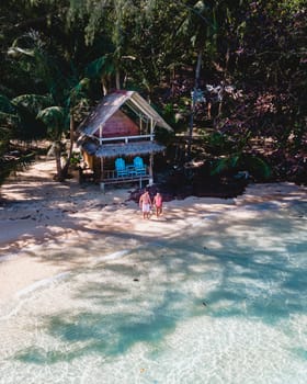 Wooden bamboo hut bungalow on the beach. a young couple of men and woman on a tropical Island in Thailand, Koh Wai Island Trat Thailand