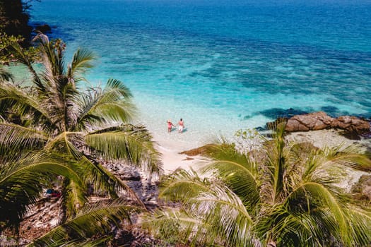 Drone aerial view at Koh Wai Island Trat Thailand is a tinny tropical Island near Koh Chang. a young couple of men and women on a tropical beach during a luxury vacation in Thailand