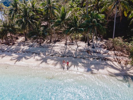 Drone aerial view at Koh Wai Island Trat Thailand is a tinny tropical Island near Koh Chang. a young couple of men and women on a tropical beach during a luxury vacation in Thailand