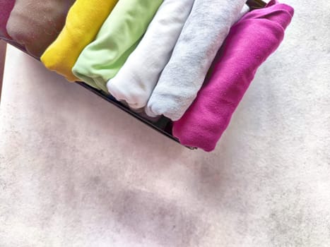 Tidy and organized clothes with the konmari method. Storage of T-shirts folded in box