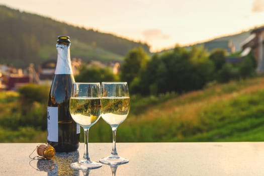 Glasses of wine against the background of mountains. Selective focus. Nature.