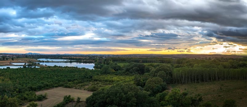 Amazing huge aerial panorama from to green countryside and a lake