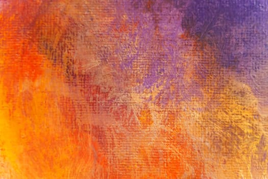 Bright texture of canvas painted in orange-yellow-violet colors with shades. Abstract background