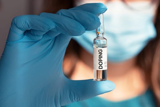 A doping ampoule in a nurse's hand closeup photo, sports doping addiction concept