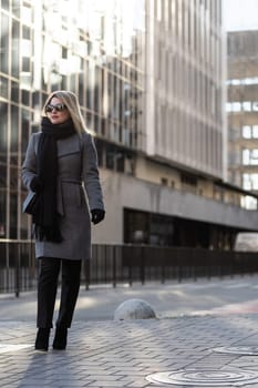 Portrait of a glamorous business woman in the street. High quality photo