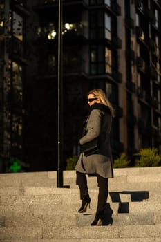 Portrait of a glamorous business woman in the street. High quality photo