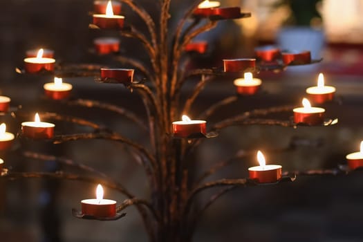 Many candles in the dark church