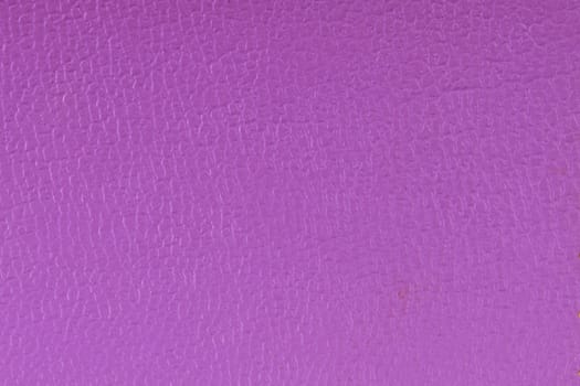 Closeup detail of purple leather texture background.