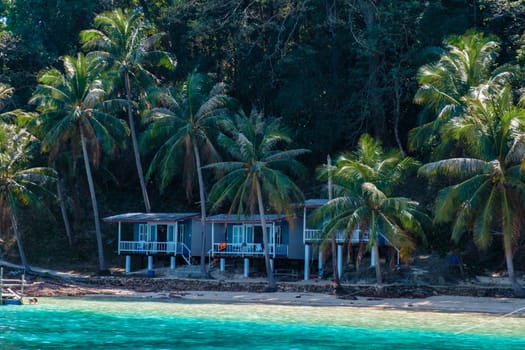 Koh Wai Island Trat Thailand is a tinny tropical Island near Koh Chang. wooden bamboo hut bungalow on the beach on a sunny day