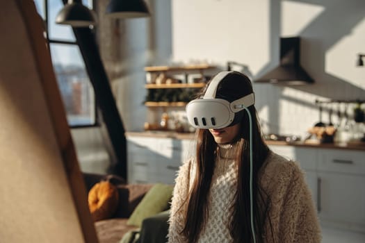 In the sunshine, a lively young woman uses a virtual reality headset in front of the mirror. High quality photo