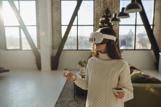A beautiful young woman in a virtual reality headset is sharing her impressions/experiences. High quality photo