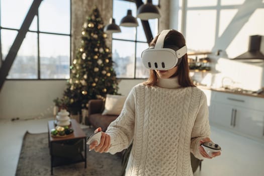 Expressing her thoughts, the lovely young lady in a virtual reality headset speaks about her experiences. High quality photo