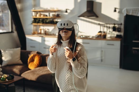 Amidst sunlight, an energetic young woman engages with a VR headset at home. High quality photo