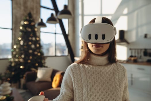 The beautiful girl in a virtual reality headset is expressing her experiences. High quality photo