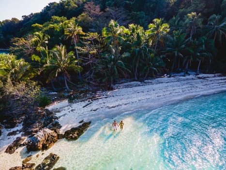Drone aerial view at Koh Wai Island Trat Thailand is a tinny tropical Island near Koh Chang. a young couple of men and women on a tropical beach during vacation in Thailand