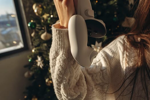 An energetic young girl was gifted a virtual reality headset for Christmas. High quality photo
