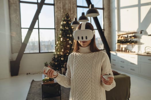 The beautiful young woman in a VR headset is describing her experiences. High quality photo