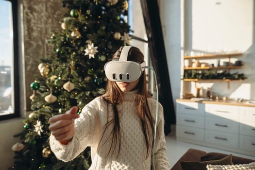The image captures a beautiful girl wearing a VR headset, set against a Christmas tree. High quality photo