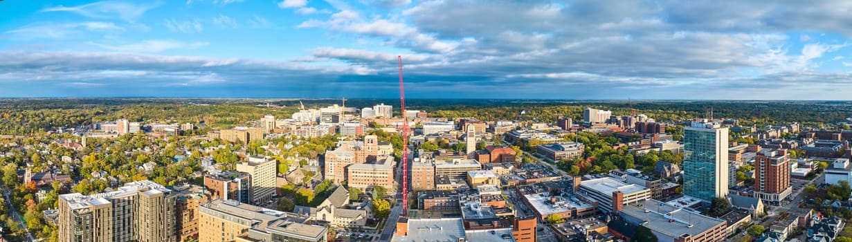 Aerial View of Urban Expansion in Downtown Ann Arbor, Michigan - A Blend of Modern and Traditional Architecture with Greenery